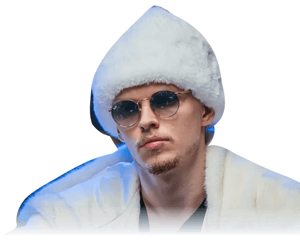 Ossi Ketola, known as Monarch, wearing a white coat and fur hat at Triton Poker